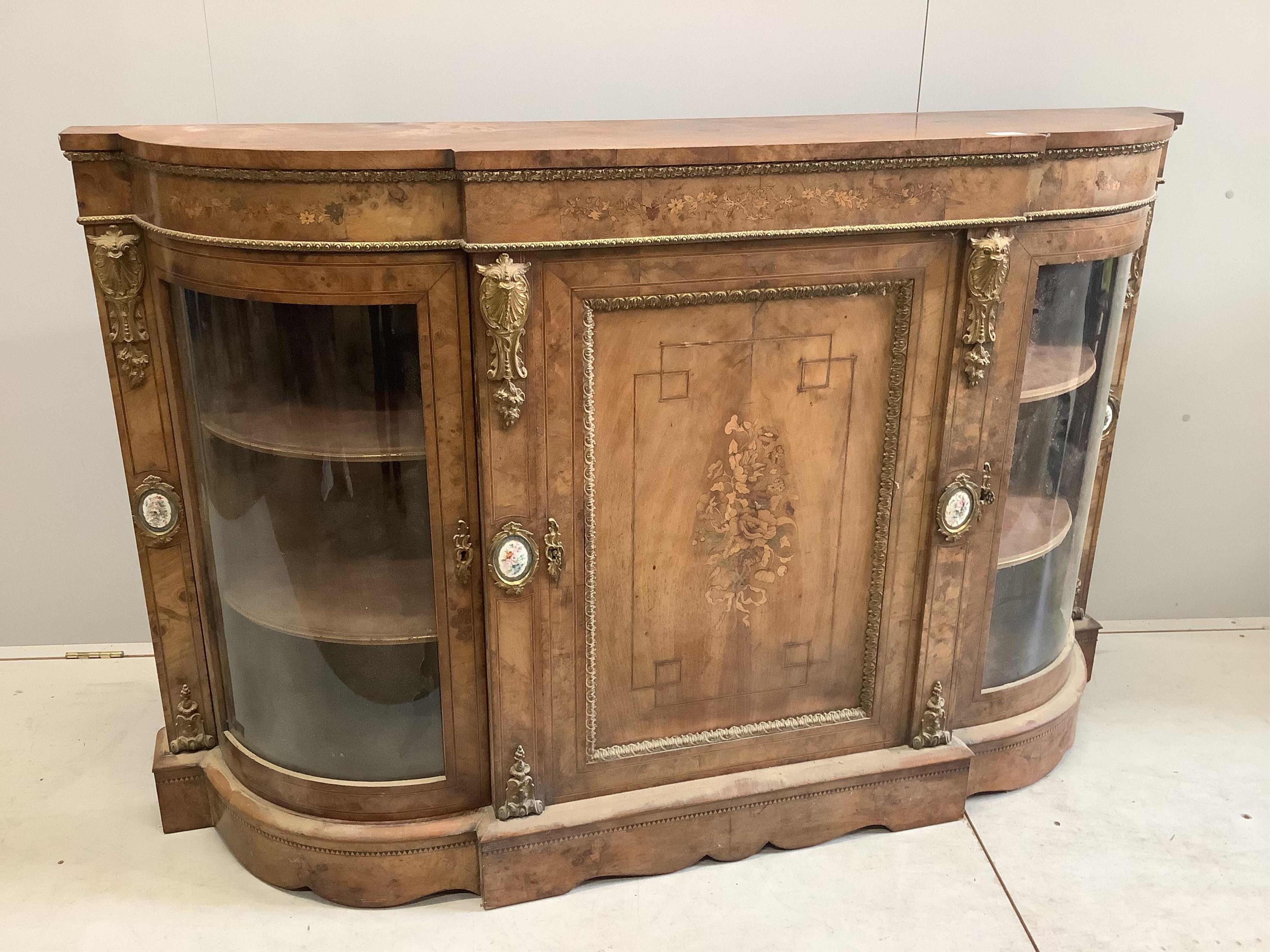 A Victorian marquetry inlaid, gilt metal mounted bowfront side cabinet